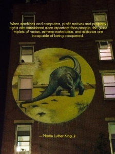 Dino not extinct yet! Photo: Saw this street art moon bubble up on a building while walking between Union Square & the East Village, NYC.